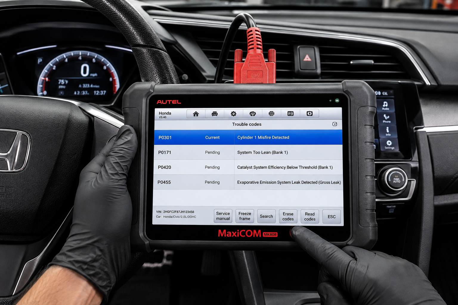 Technician reading engine trouble codes on a diagnostic scanner